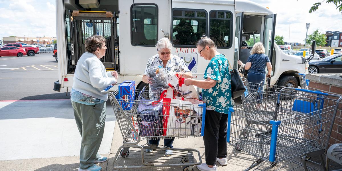 Seniors outside of a bus