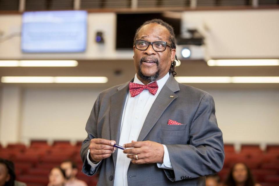 Darryl Hood giving a lecture in a classroom.