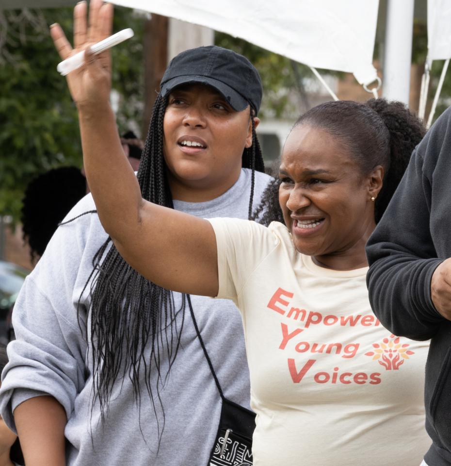 Dr. Elaine Richardson at an event outside wearing a shirt that says Empower Young Voices.
