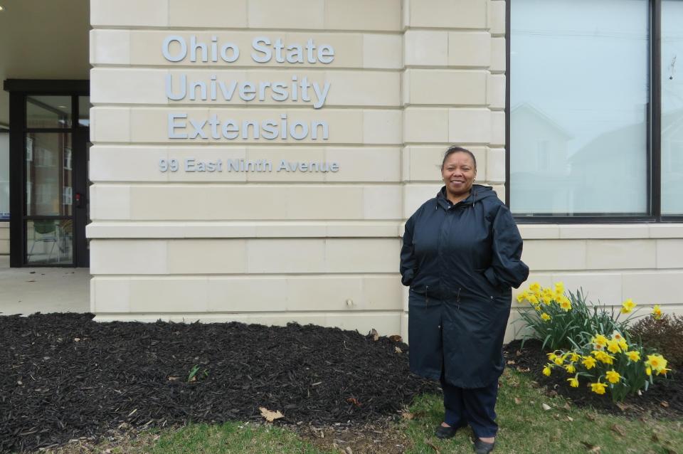 Susan Colbert standing in front of the Ohio State University Extension building.