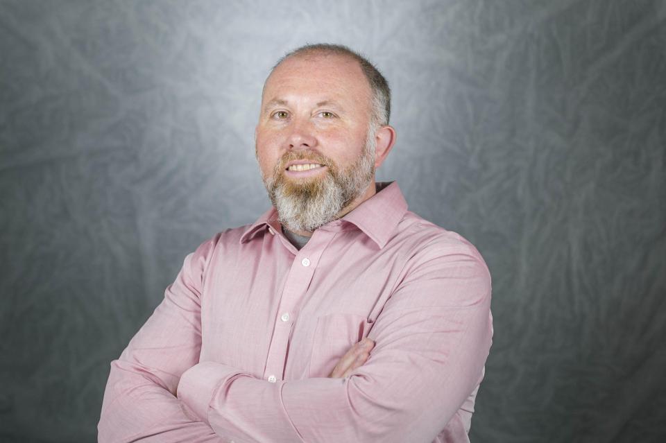 Headshot of Jason Reece.