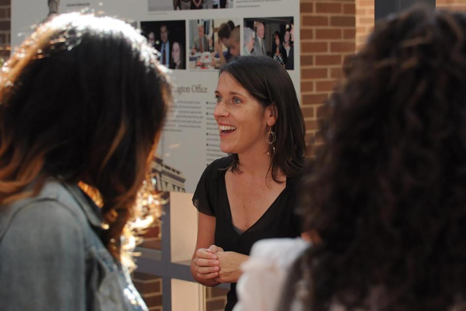 Jill Clark talking with students.