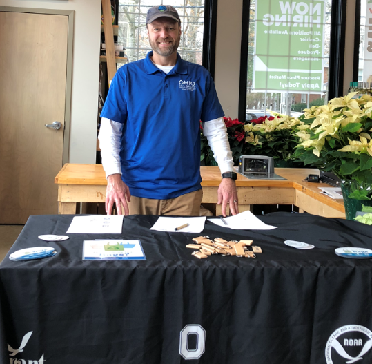 Scott Hardy standing at an OSU Sea Grant and Stone Lab tabling event.