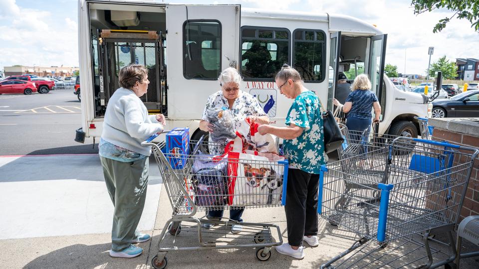 Seniors outside of a bus