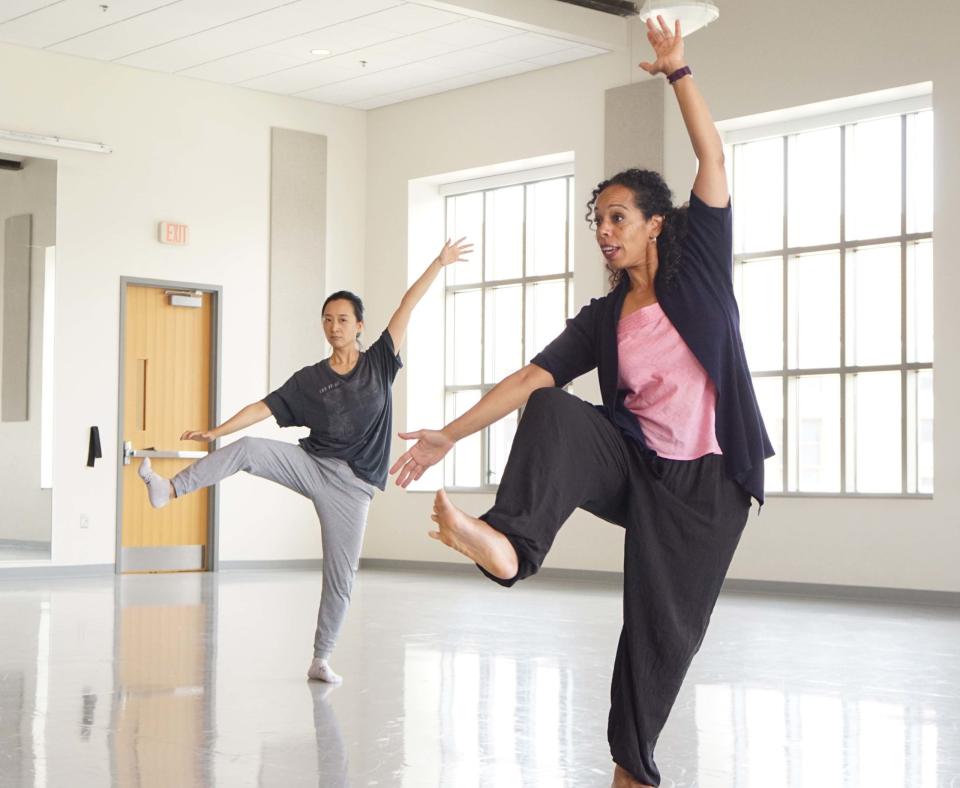 Nyama McCarthy-Brown instructing students in a dance class.