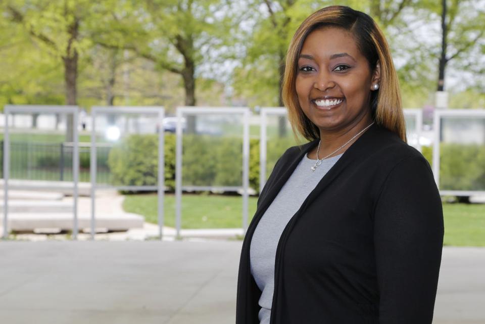 Headshot of Quanetta Batts in front of a background with trees.